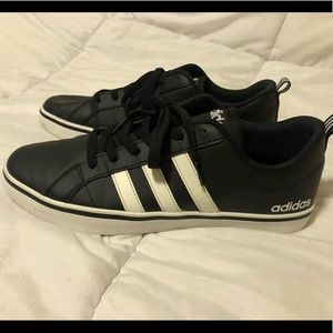 black and white Neo adidas sneakers.